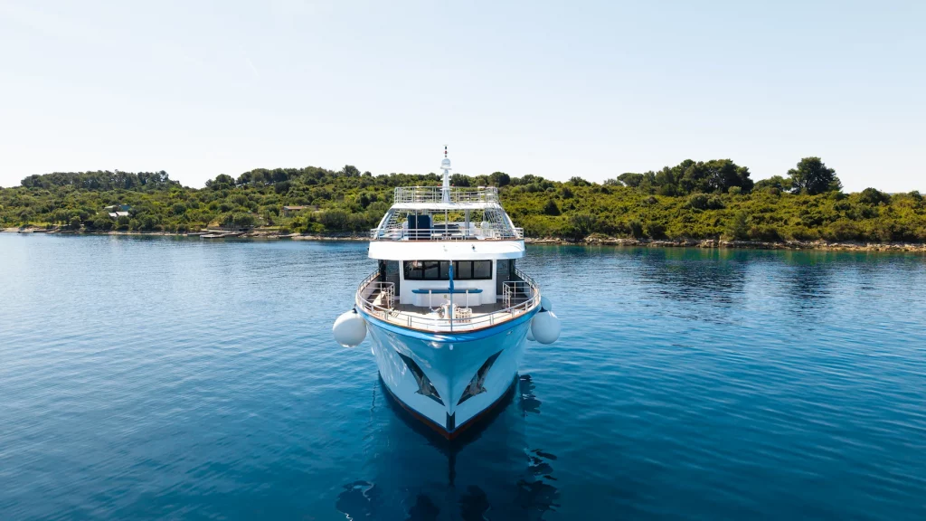 Zantium small cruise ship anchored in a calm Adriatic bay in Croatia.