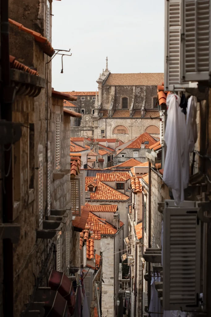 View across the terracotta rooftops and historic stone buildings of Dubrovnik Old Town, Croatia.