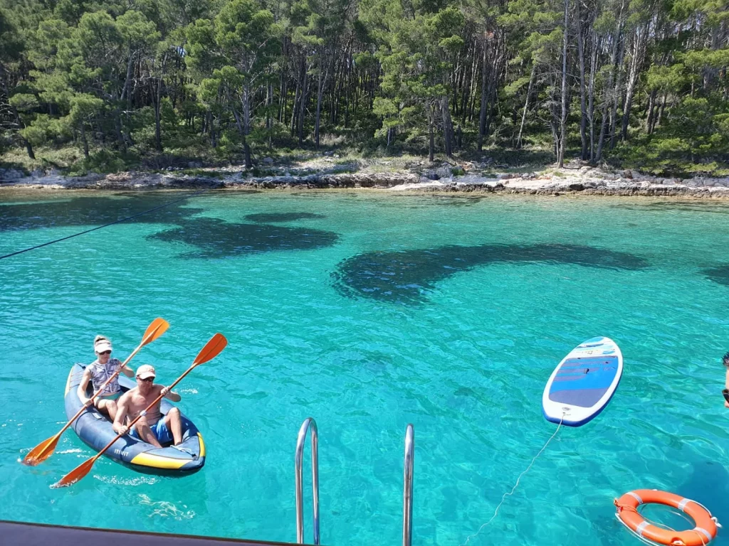 Guests kayaking during a swim stop on a Croatia private cruise